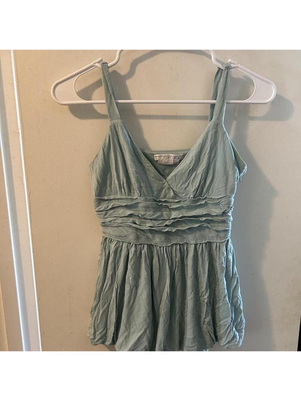 To The Max light blue babydoll top in a size 2